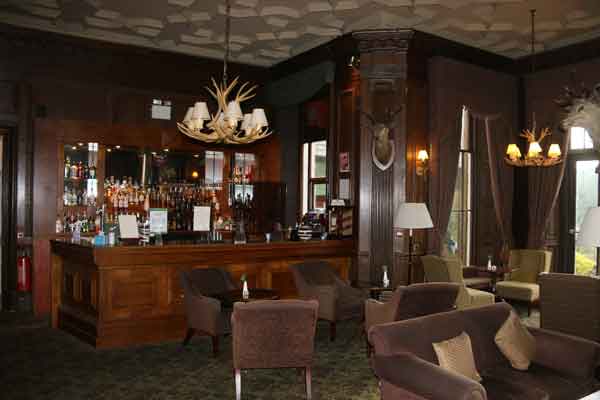 A wee dram goes down a treat in the wood panelled bar. at Stonefield Castle